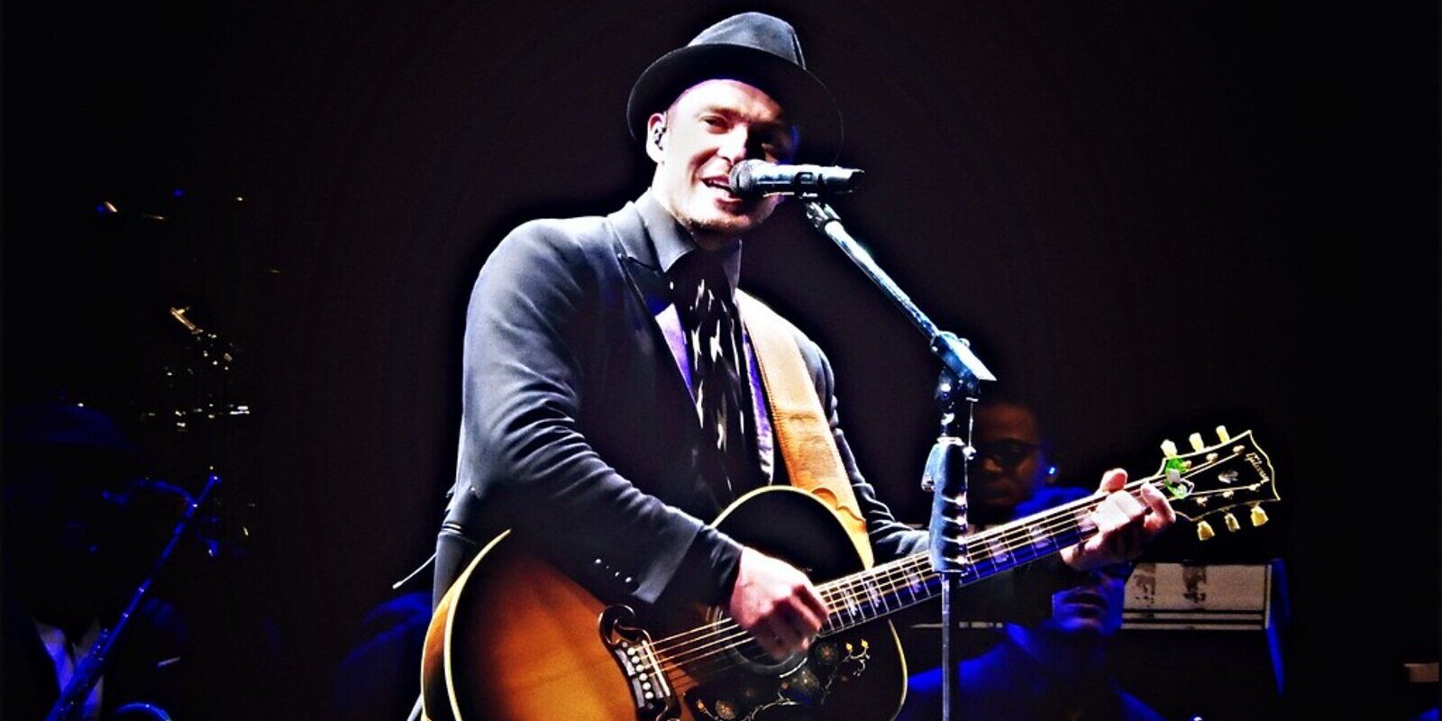 Justin Timberlake, V Festival, Chelmsford by Drew de F Fawkes is licensed under CC BY 2 man playing guitar